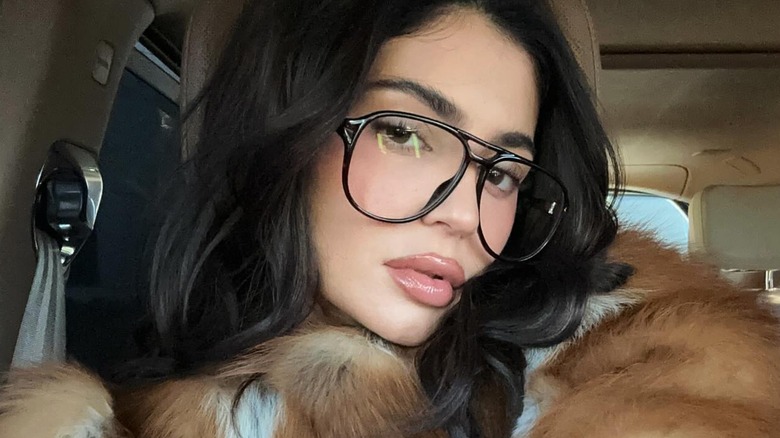 Kylie Jenner posing in black framed glasses