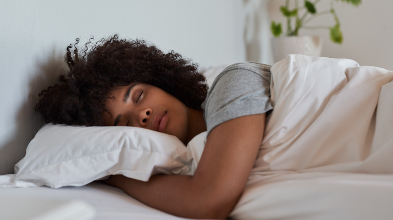 A woman asleep in bed