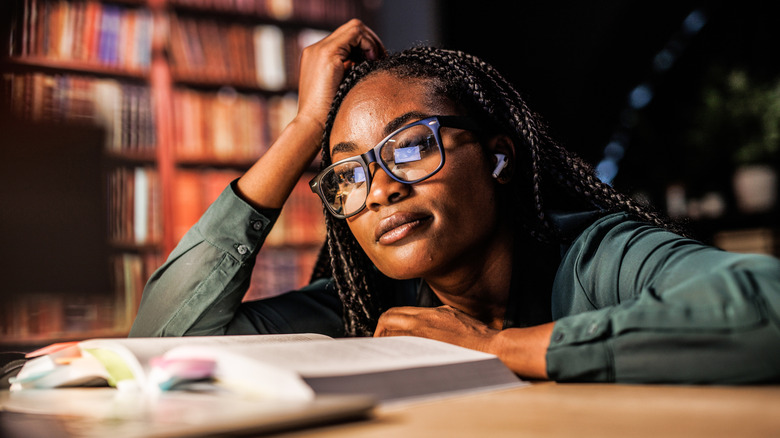 Woman reading in atmospheric setting