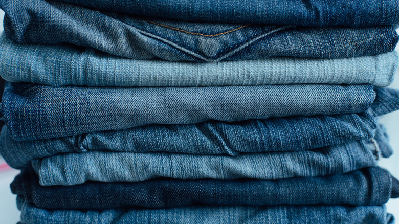 A stack of multi-colored blue jeans