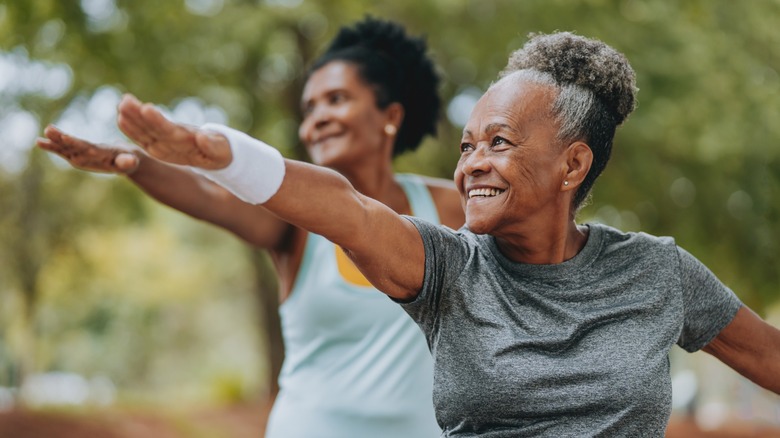 Two older women working out
