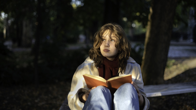 Woman reading outside