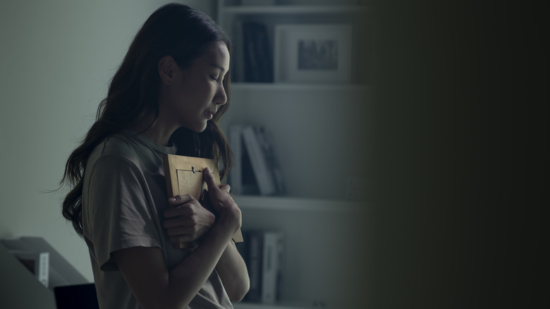 Woman grieves loved one