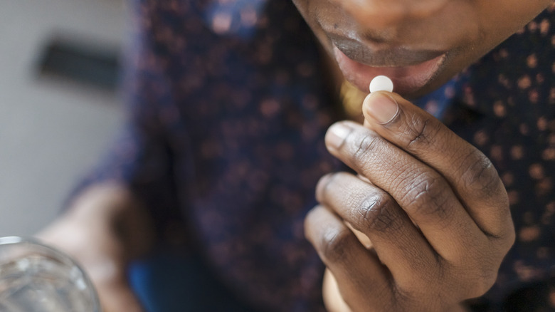 Person taking birth control pill