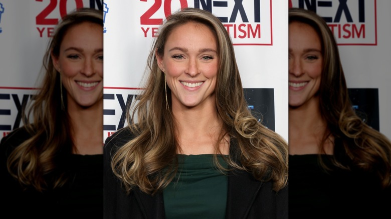 Kylie Kelce smiling at an event while wearing blush and mascara