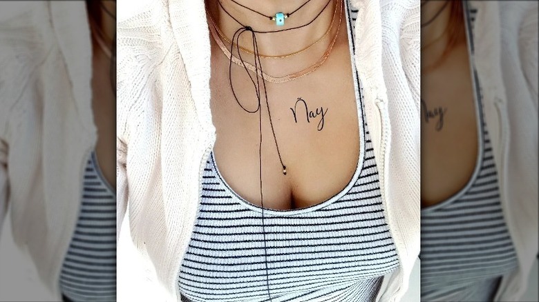 Person wearing stack of chokers