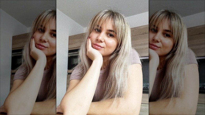 Woman with eyelash bangs