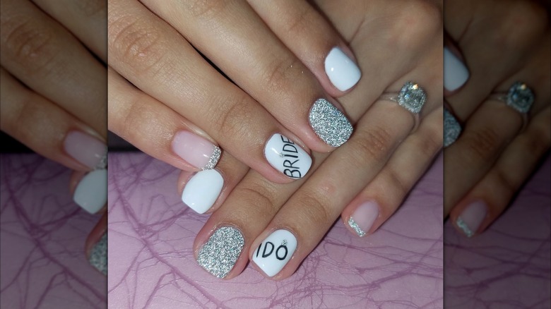 Bridal nails in black, white, and silver on Instagram