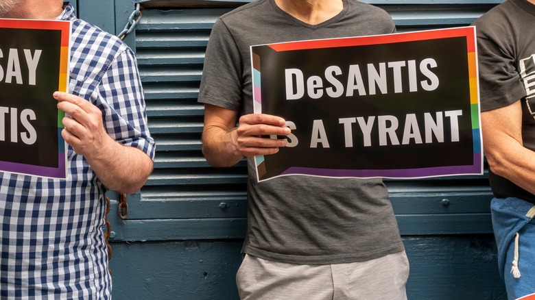 Protestors in Florida holding signs