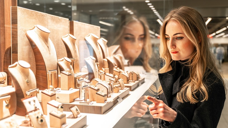 Woman looking at jewelry