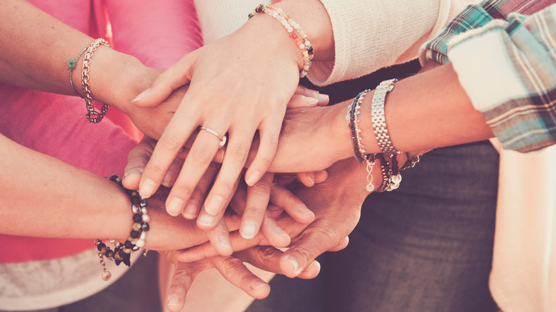 Hands with friendship bracelets