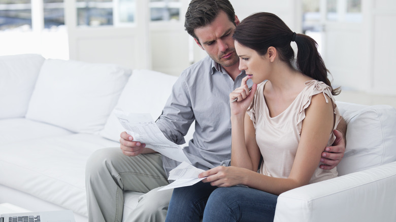 Couple looking concerned