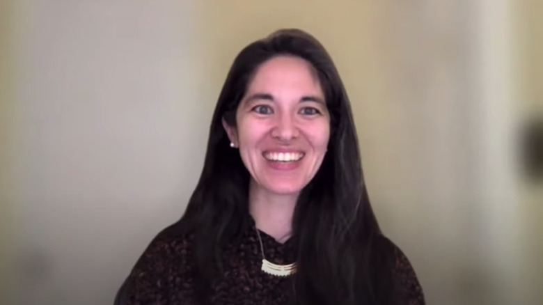 Miya Tokumitsu giving a talk