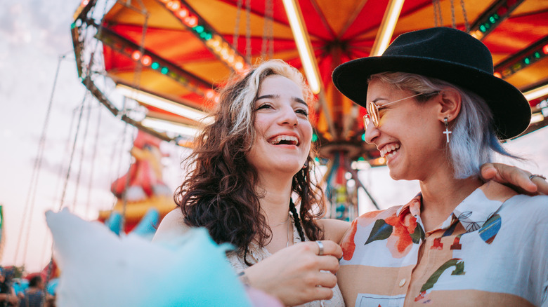 young women smiling carnival