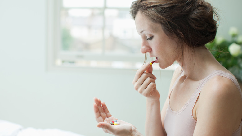 Woman taking pills