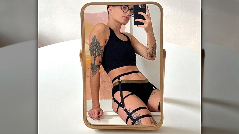 Person in Origami Customs lingerie