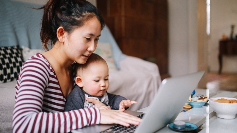 Woman working with baby