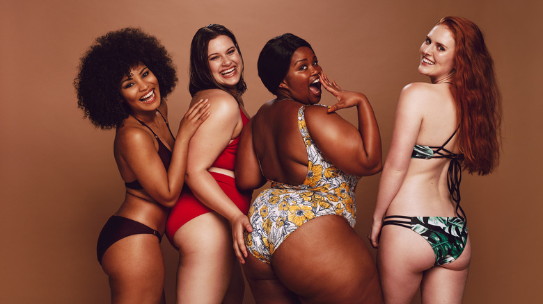 Women posing in swimsuits