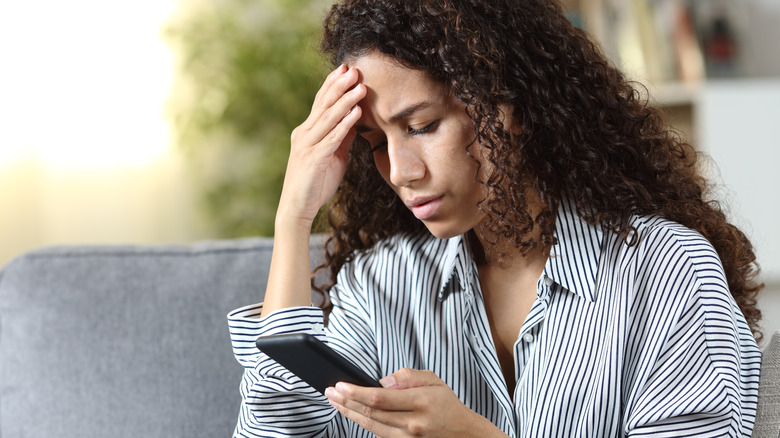 woman looking at phone