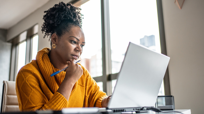 Woman researching on a laptop