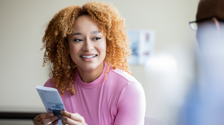 woman discusses options with therapist
