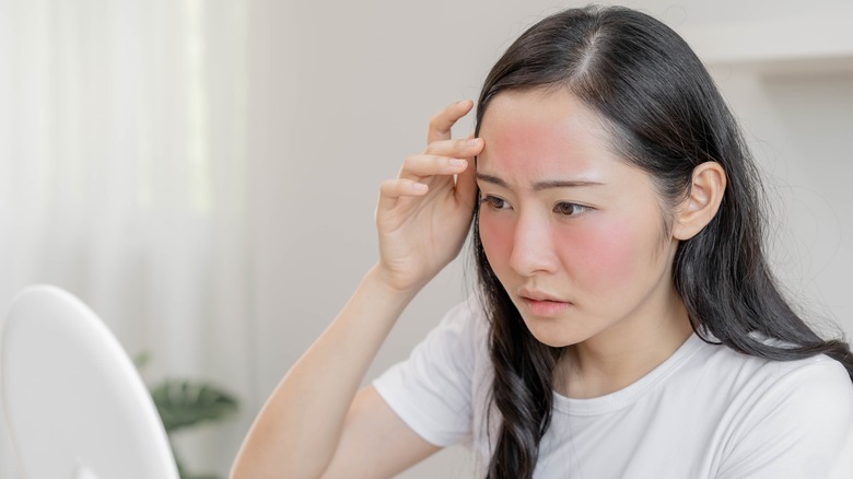 Woman looking in a mirror