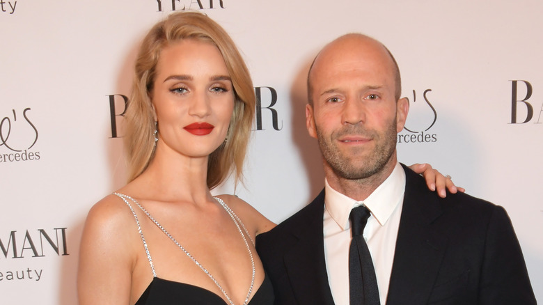 Rosie Huntington-Whiteley posing with Jason Statham
