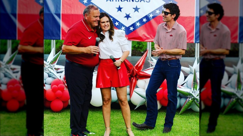 Sarah Huckabee Sanders with husband and another man at an event