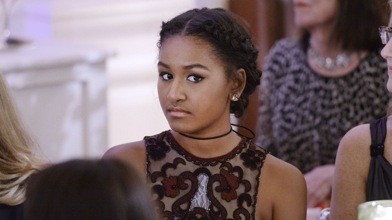 Sasha Obama sitting down