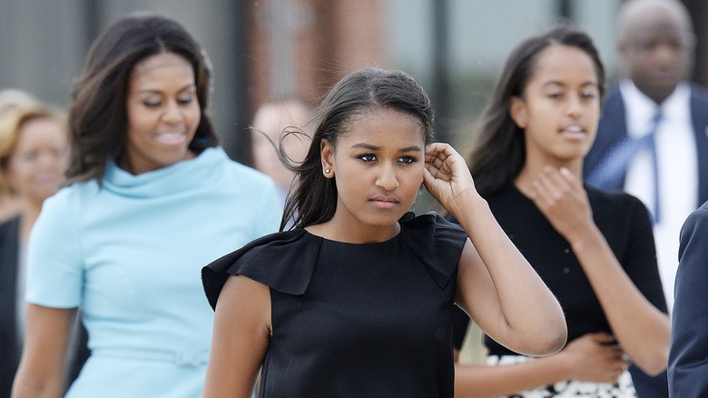 Sasha Obama with her mom and sister