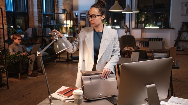 Woman preparing to leave work