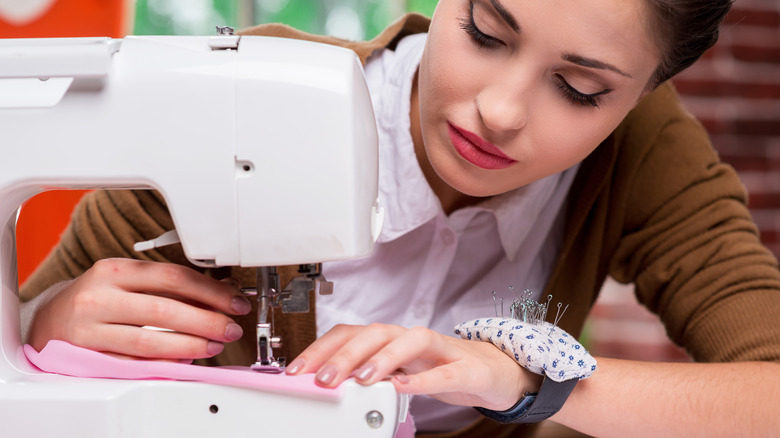 woman with sewing machine