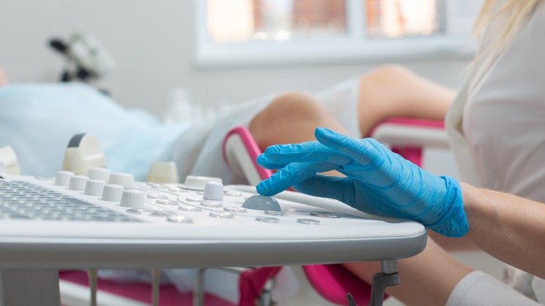 Gynecologist performing medical routine