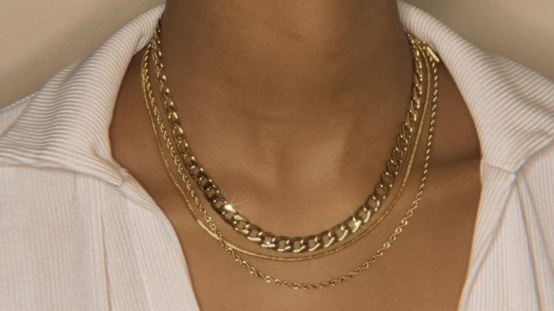 Woman with layered silver necklaces