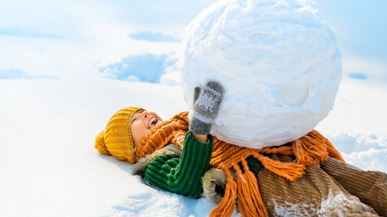 A child playing in the snow