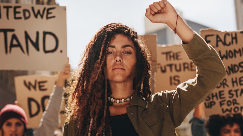 Woman holding up her fist