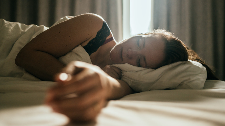 A woman in bed in the dark