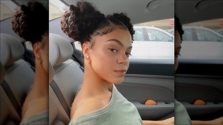 Woman taking mirror selfie