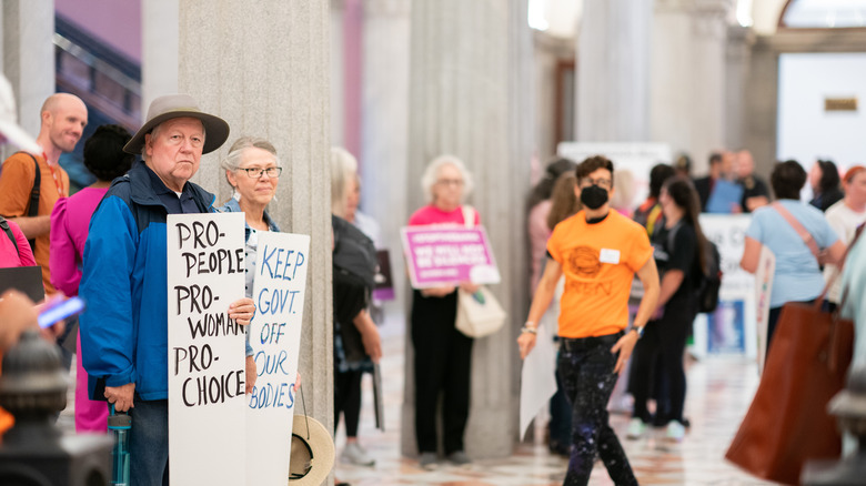 People holding abortion rights signs
