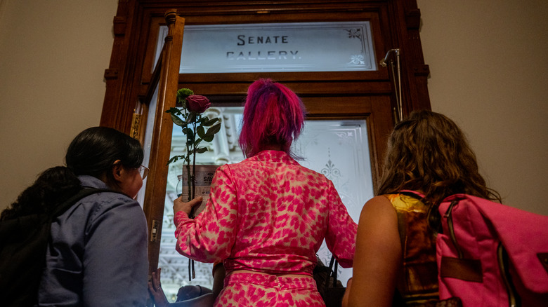 People walking into Senate Gallery
