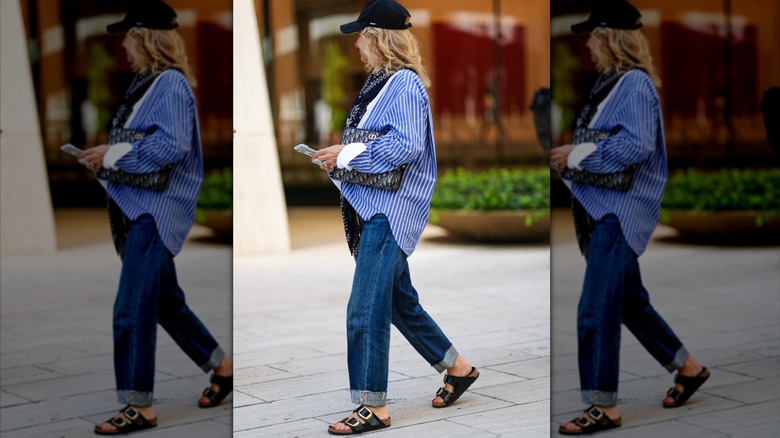 A guest attends NYFW for S/S 25 wearing the Arizona Big Buckle Sandals from Birkenstock