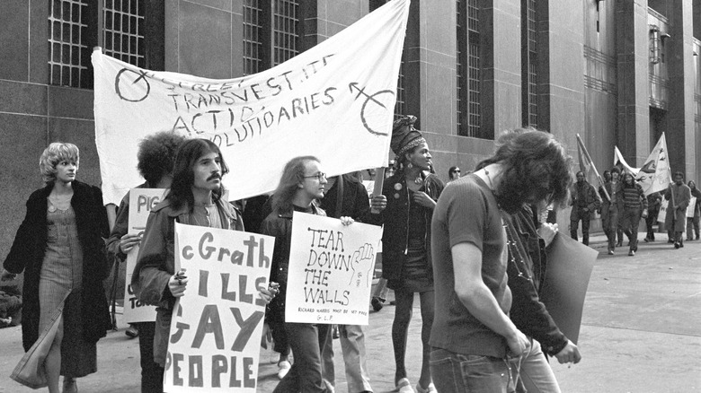 Sylvia Rivera walking with stonewall protesters