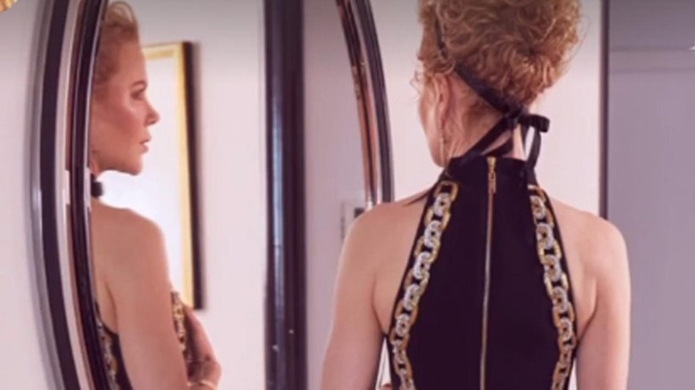 Nicole Kidman looks in mirror