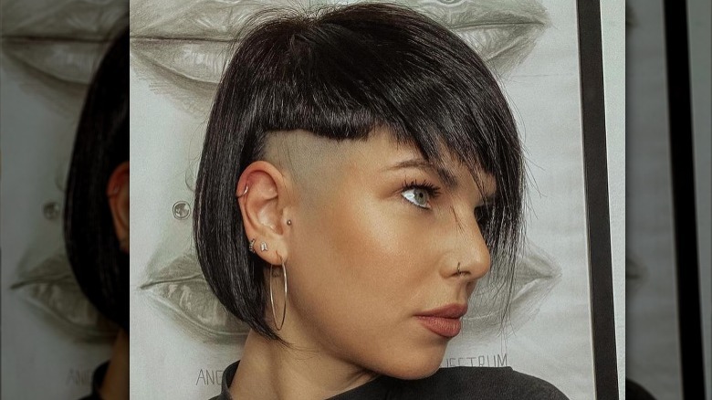 Woman with an undercut bob, posing