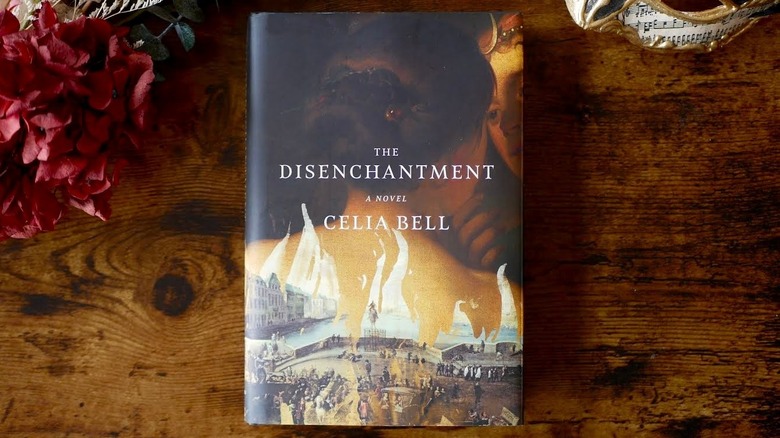 "The Disenchantment" book on wooden table