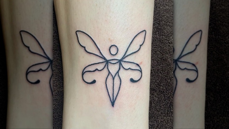 Uterus fairy tattoo