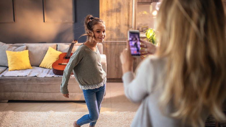 mom recording daughter