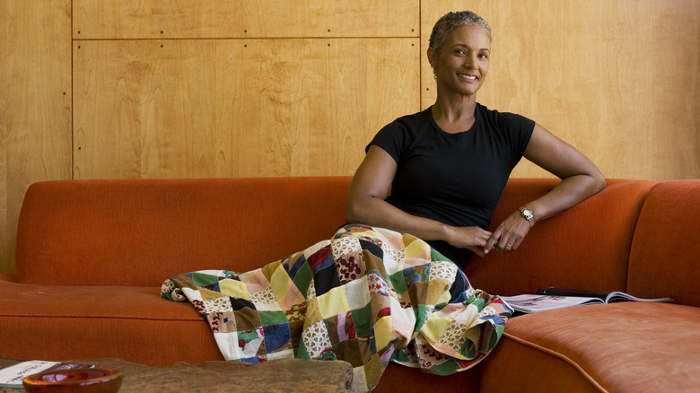 smiling woman on a couch