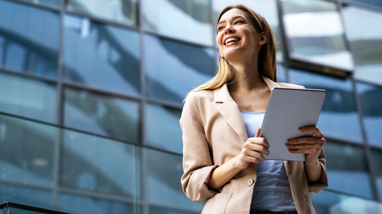 woman holding a tablet