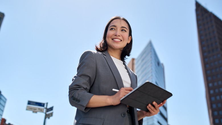woman holding a tablet
